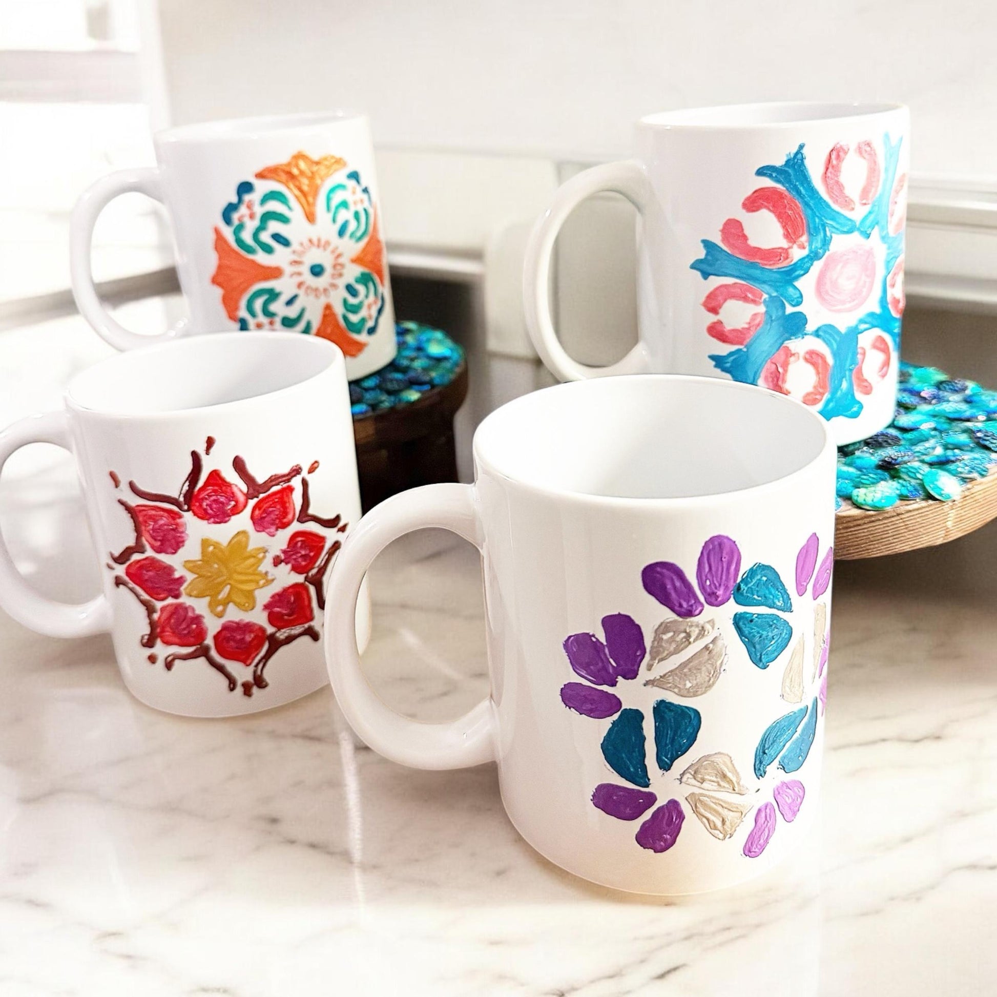 Handpainted coffee mugs by My Store featuring colorful, artistic designs on ceramic mugs perfect for everyday use.