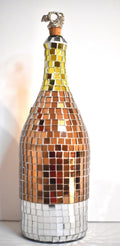 Luxury gold mosaic wine decanter with intricate design and elegant shape, perfect for serving and displaying wine.
