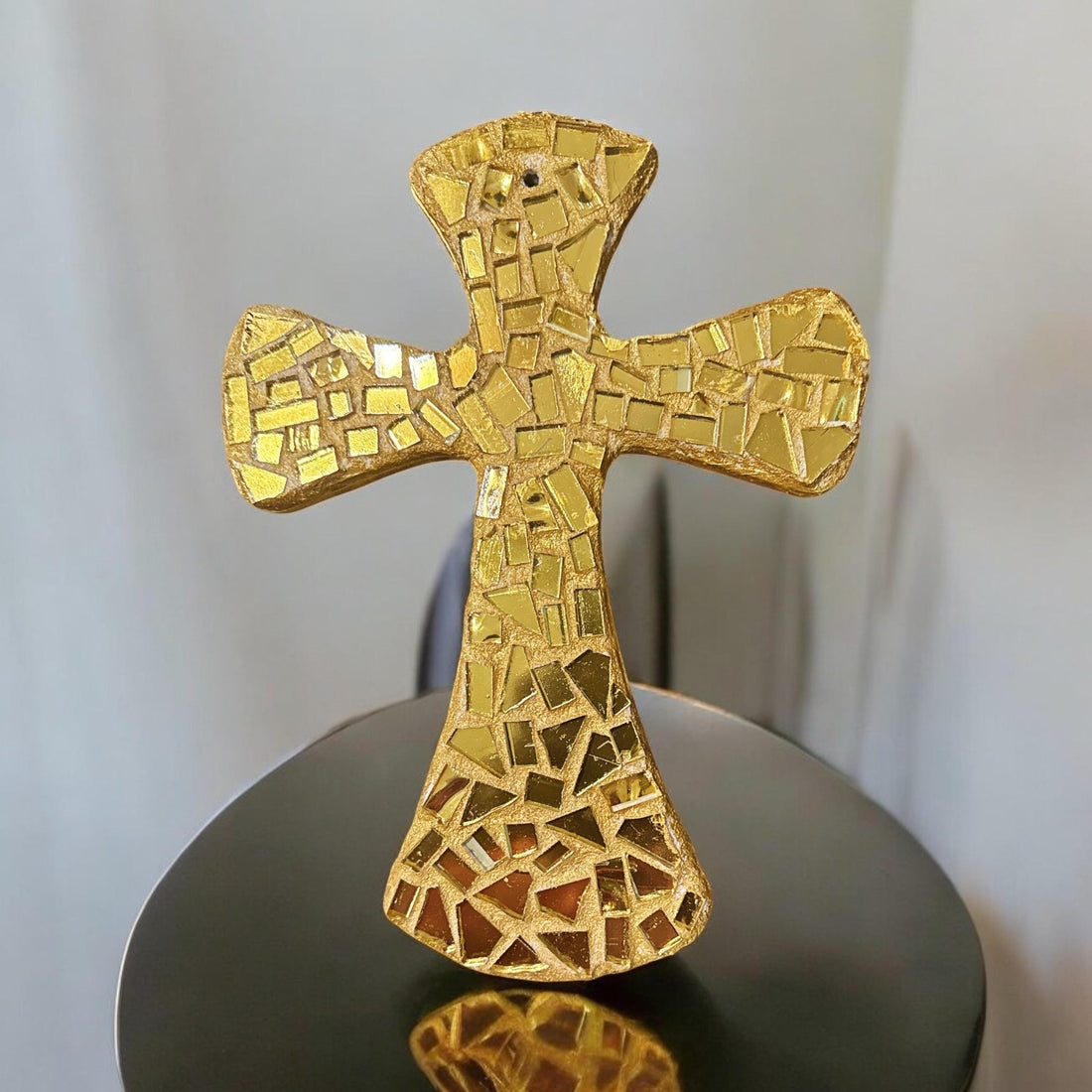 Handcrafted gold mosaic cross with intricate patterns, created by Miss Bette's Creations, detailed close-up view.