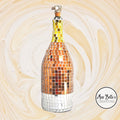 Elegant gold mosaic wine decanter with intricate design, perfect for showcasing and serving wine in a luxurious style.