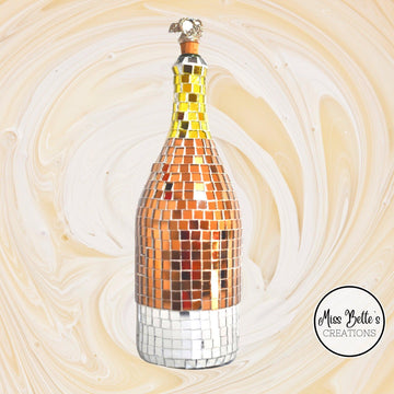 Elegant gold mosaic wine decanter with intricate design, perfect for showcasing and serving wine in a luxurious style.