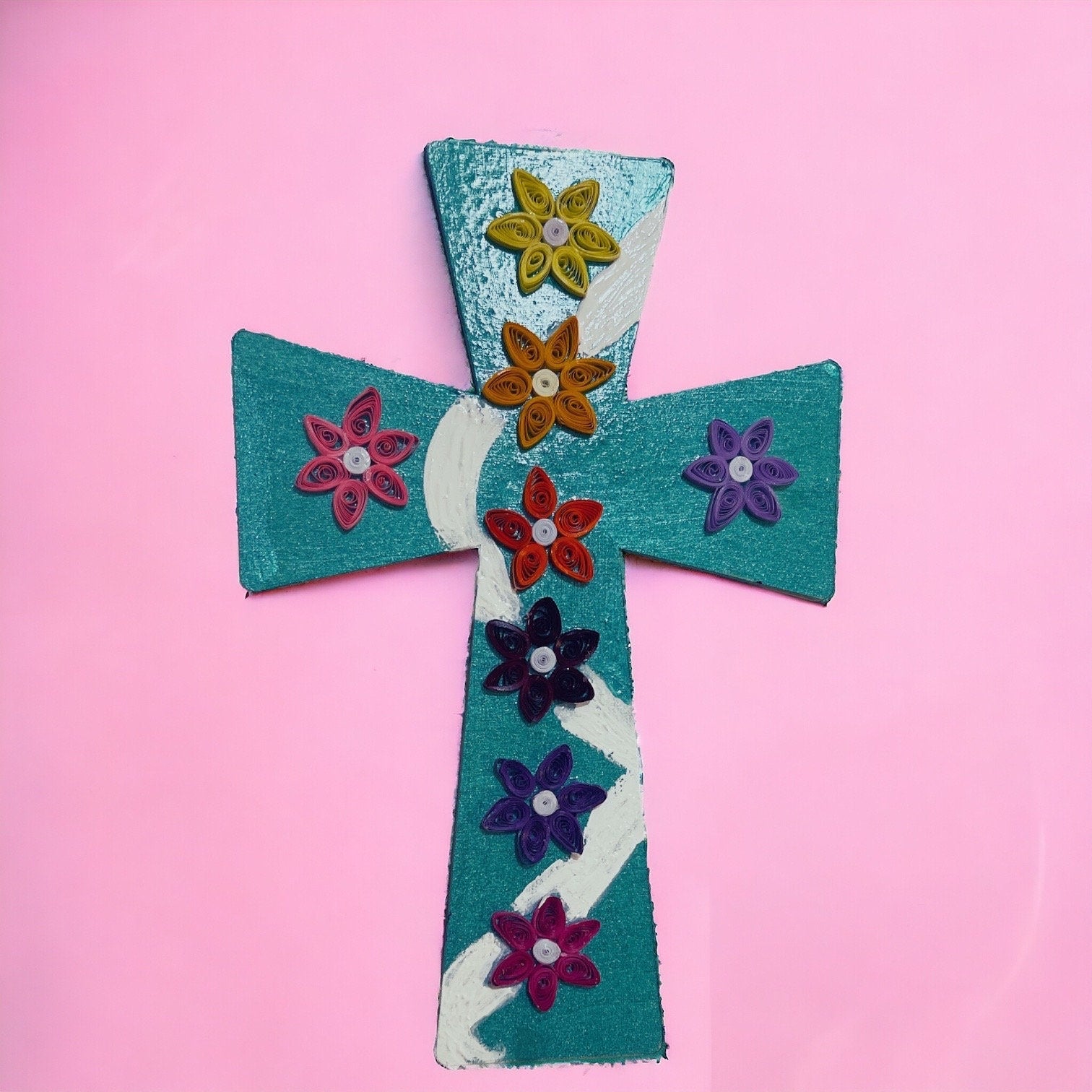 Handcrafted mosaic cross with colorful tile patterns, detailed design, and textured surface, showcasing artisanal craftsmanship.
