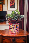 Colorful handcrafted rainbow mosaic planter with vibrant tiles, perfect for indoor or outdoor plants.