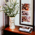 Elegant mother of pearl mosaic flower vase featuring intricate floral design and glossy finish, ideal for decorative home display.