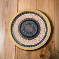 Colorful handcrafted circular mosaic mandala wall art showcasing intricate patterns and vibrant tiles for home decor.