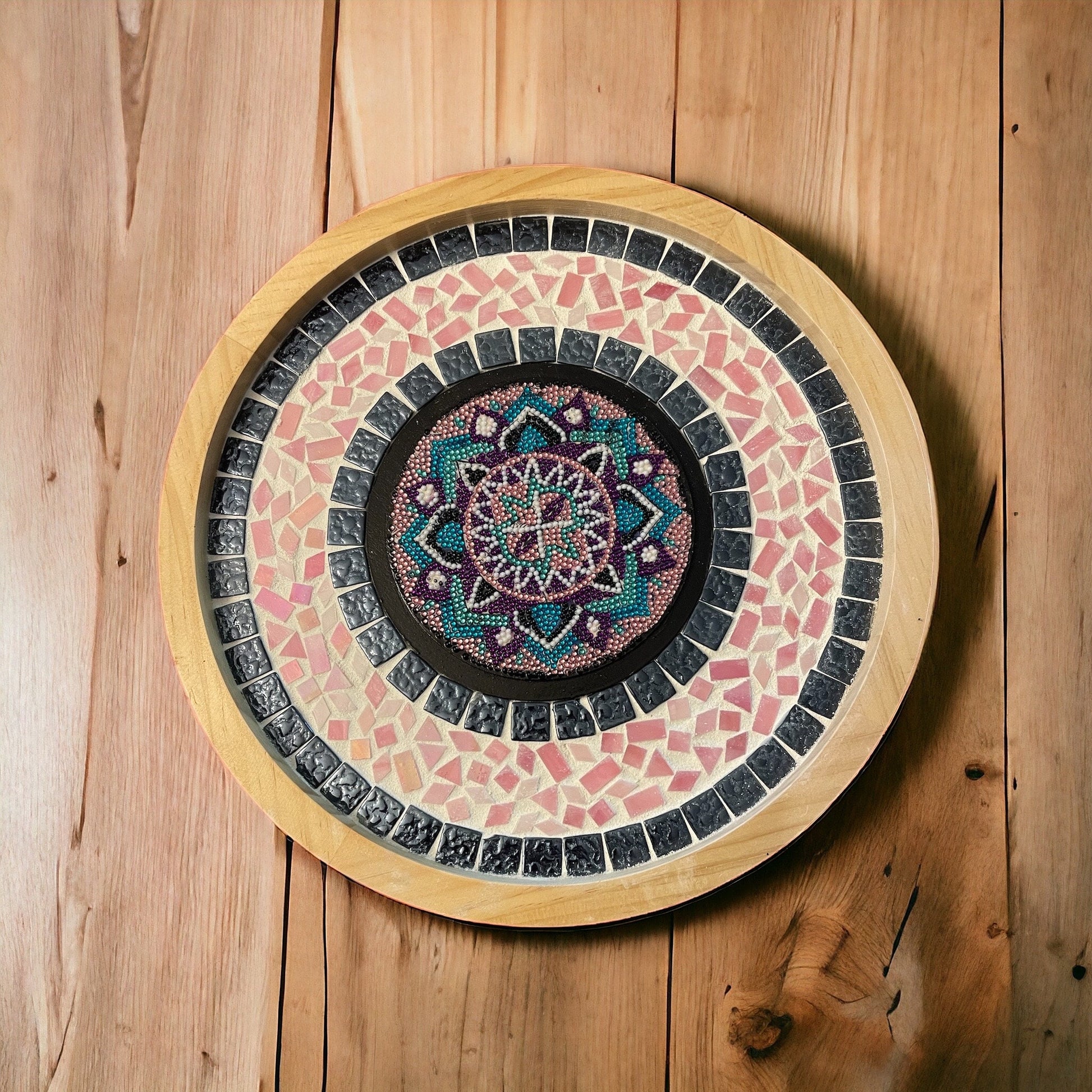 Colorful handcrafted circular mosaic mandala wall art showcasing intricate patterns and vibrant tiles for home decor.