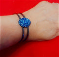 Deep blue glass cuff bracelet featuring smooth, rounded edges and a polished finish, stylish accessory for any outfit