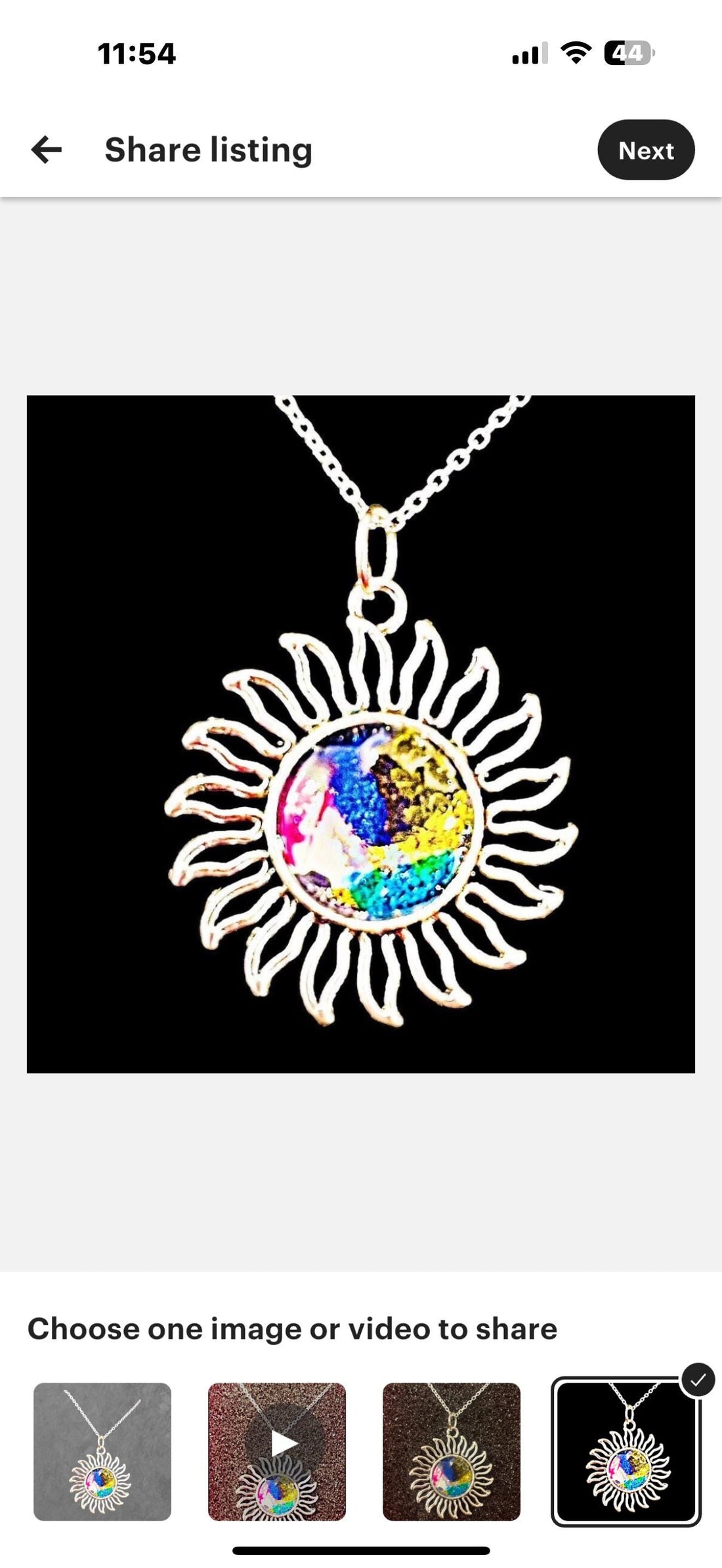Multicolored glass sunburst pendant necklace with silver chain, featuring vibrant stained glass design, from My Store.