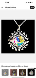 Multicolored glass Sunburst pendant necklace with silver chain, featuring stained glass design and vibrant hues.