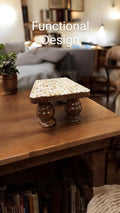 Vintage hand-carved wooden pedestal stand with intricate detailing, perfect for displaying decorative items or sculptures.