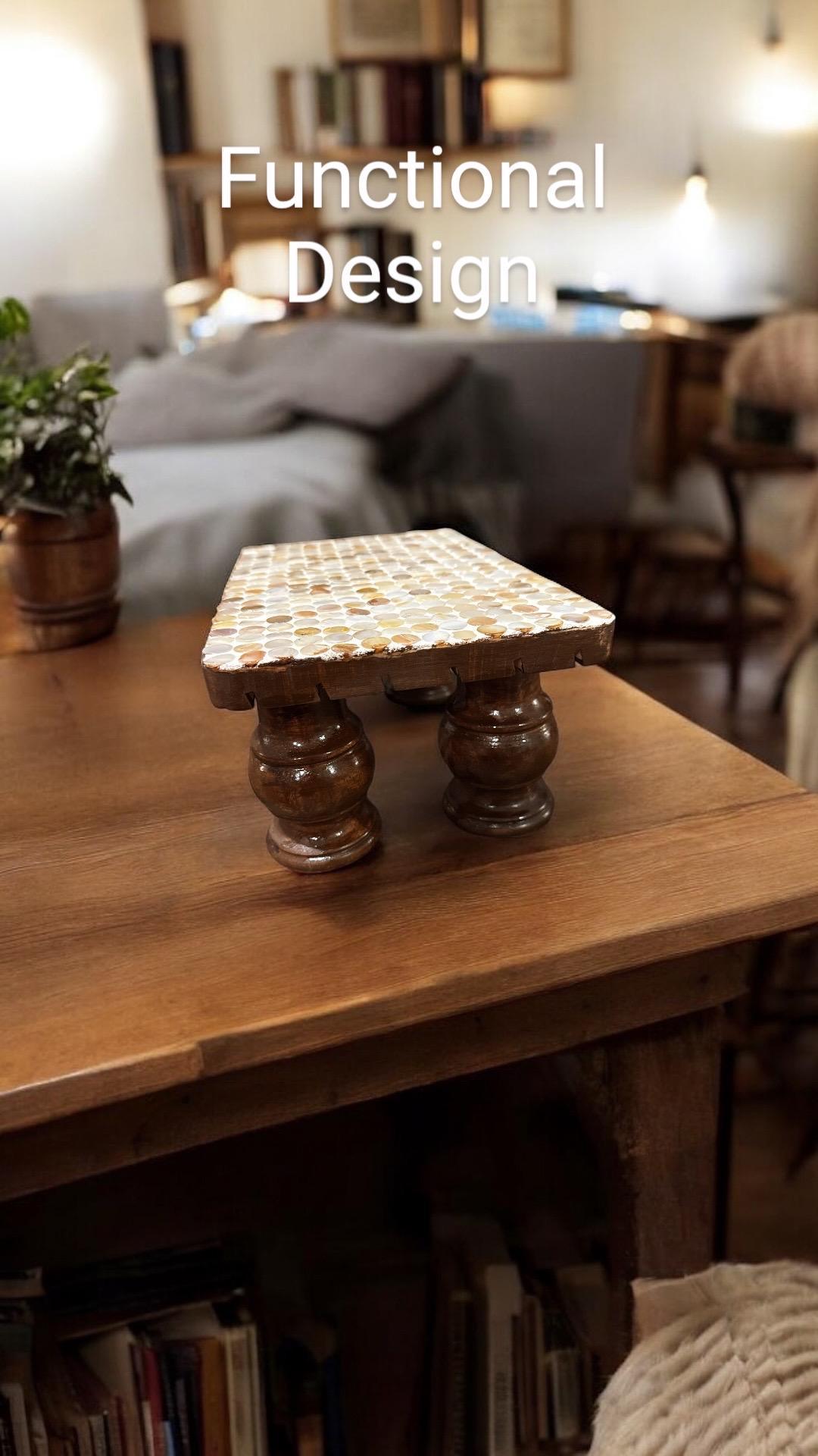 Vintage hand-carved wooden pedestal stand with intricate detailing, perfect for displaying decorative items or sculptures.