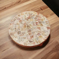 Handmade mother of pearl mosaic plant stand with intricate designs, crafted for elegant indoor or outdoor plant display.
