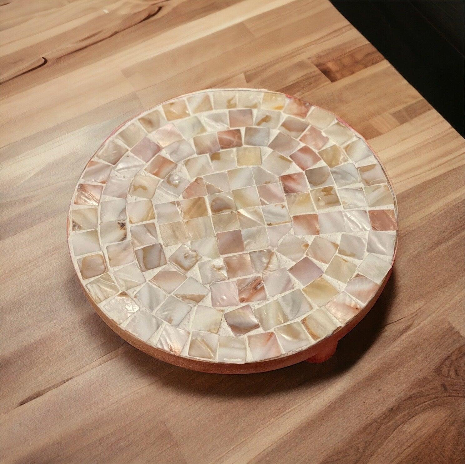 Handmade mother of pearl mosaic plant stand with intricate designs, crafted for elegant indoor or outdoor plant display.