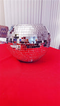 Shimmering mirror ball disco globe vase with reflective surface, perfect for modern home decor or party centerpiece.
