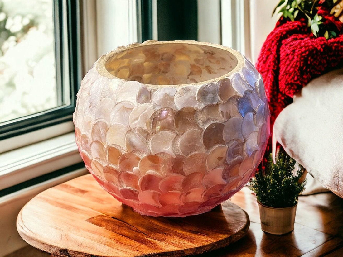 Handcrafted scalloped Capiz shell globe vase with intricate design, showcasing its elegant, translucent shell pattern.