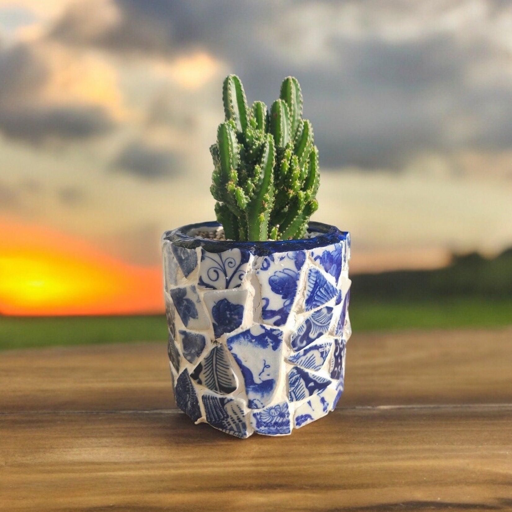 White broken china mosaic planter with intricate mosaic design, perfect for indoor or outdoor decorative plant display.