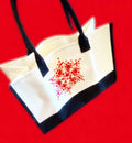 Hand-painted abstract floral canvas tote bag featuring vibrant, artistic floral designs on durable fabric.