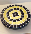 Handmade cobalt blue and yellow mosaic plant stand with intricate tile design, perfect for showcasing potted plants.