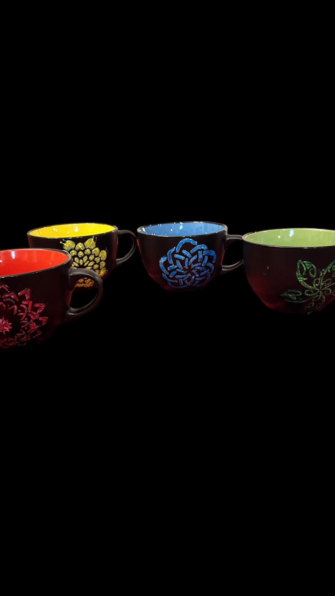 Extra large handpainted coffee mug with colorful design, perfect for enjoying your favorite hot beverages.