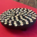 Handmade black and white iridescent mosaic plant stand with intricate tile design, perfect for indoor or outdoor plants.