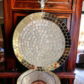 Handmade gold mirror and silver glass mosaic decorative plate with intricate pattern and reflective surface.