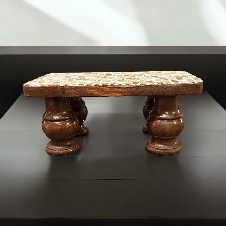 Vintage hand-carved wooden pedestal stand with intricate details, ideal for displaying decorative items or art.