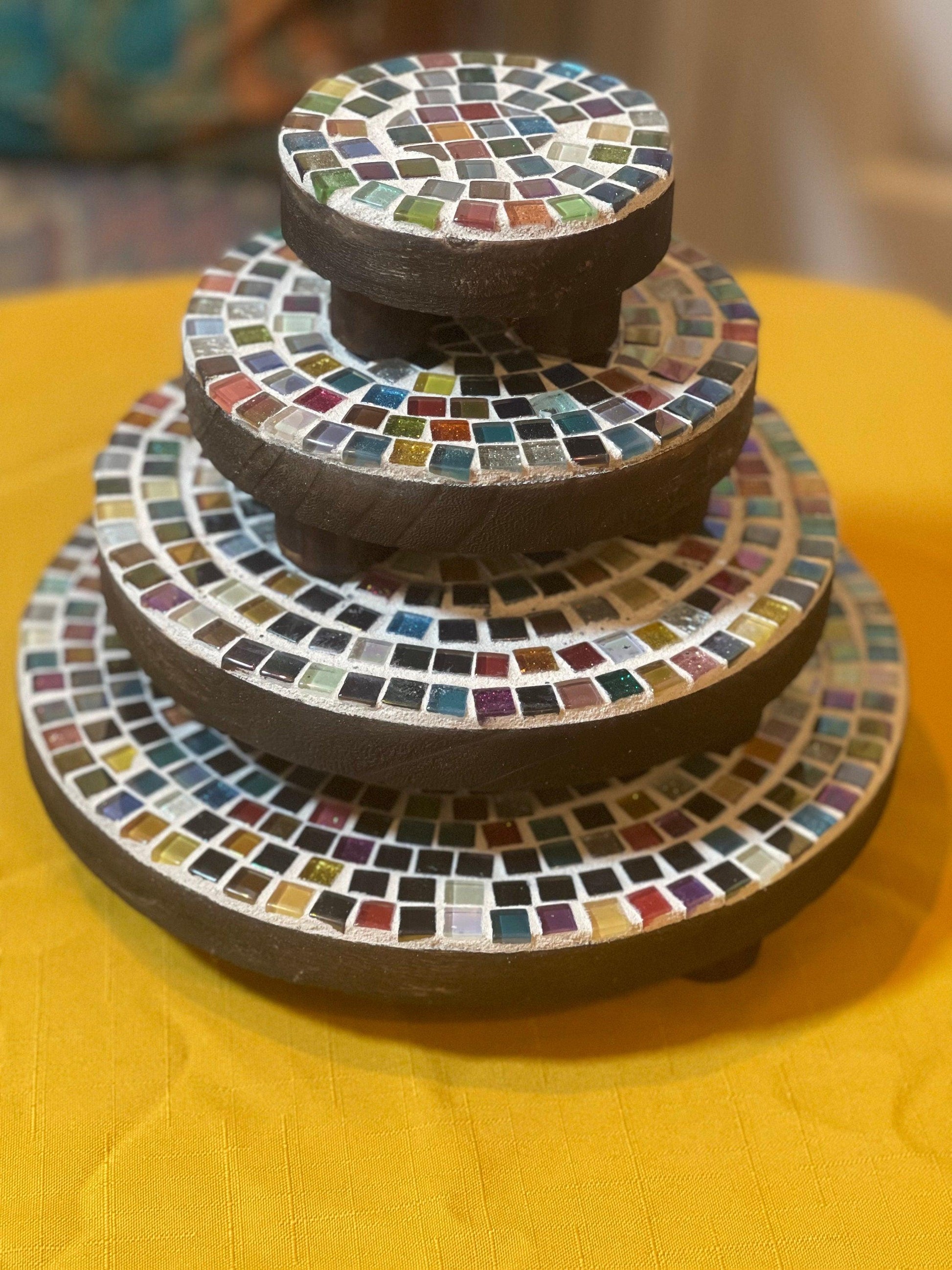 Handcrafted 4-tier mosaic plant stand set with colorful tiled shelves for indoor or outdoor decor.