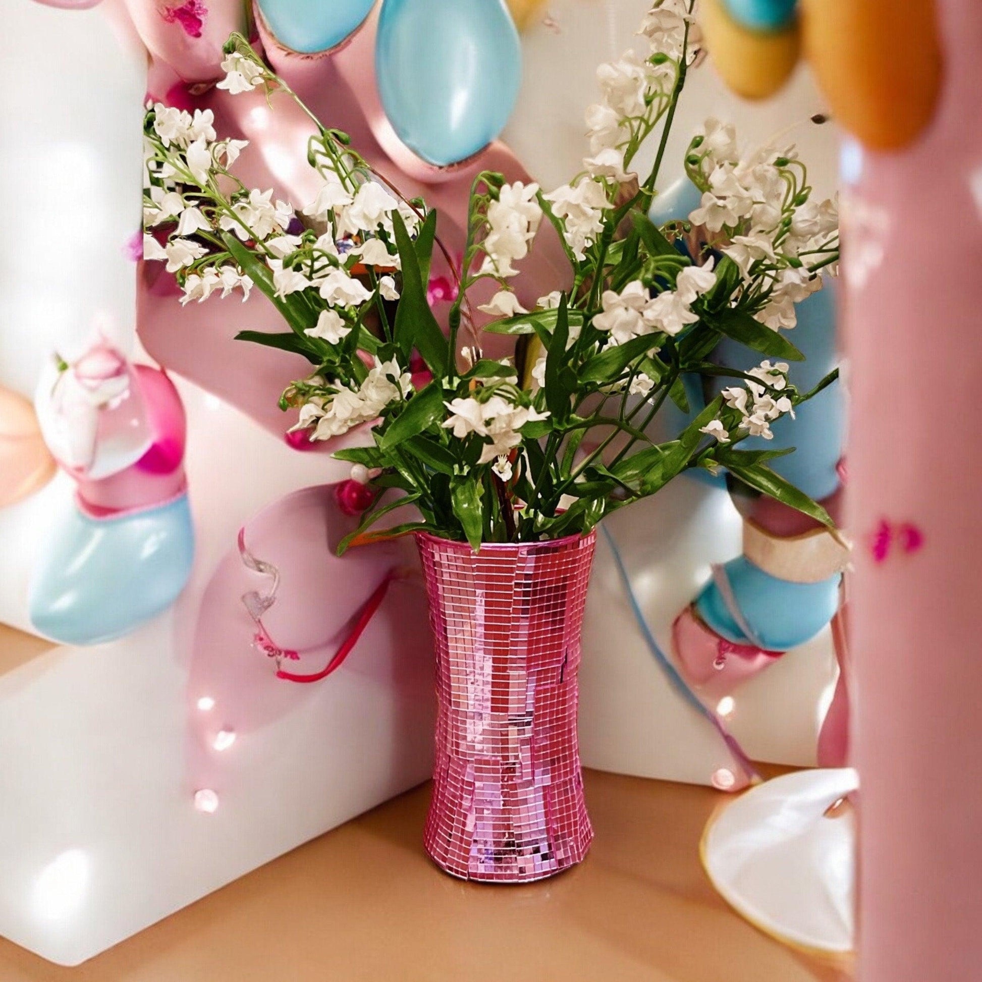Handcrafted pink disco ball mirror vase with shimmering reflective surface and decorative design, perfect for interior decor.