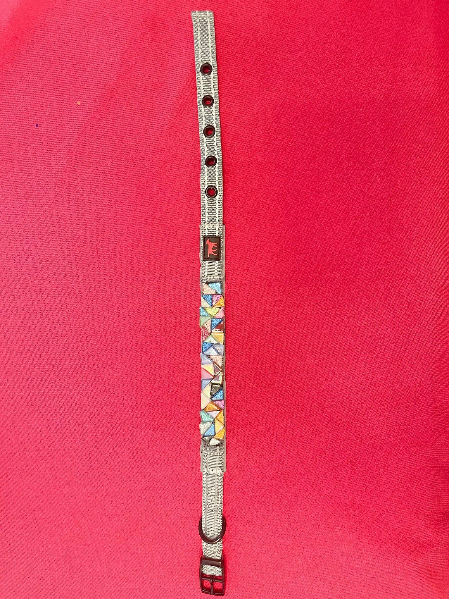 Handmade one-of-a-kind dog collar with colorful fabric and metal hardware, designed for stylish and comfortable pet wear.