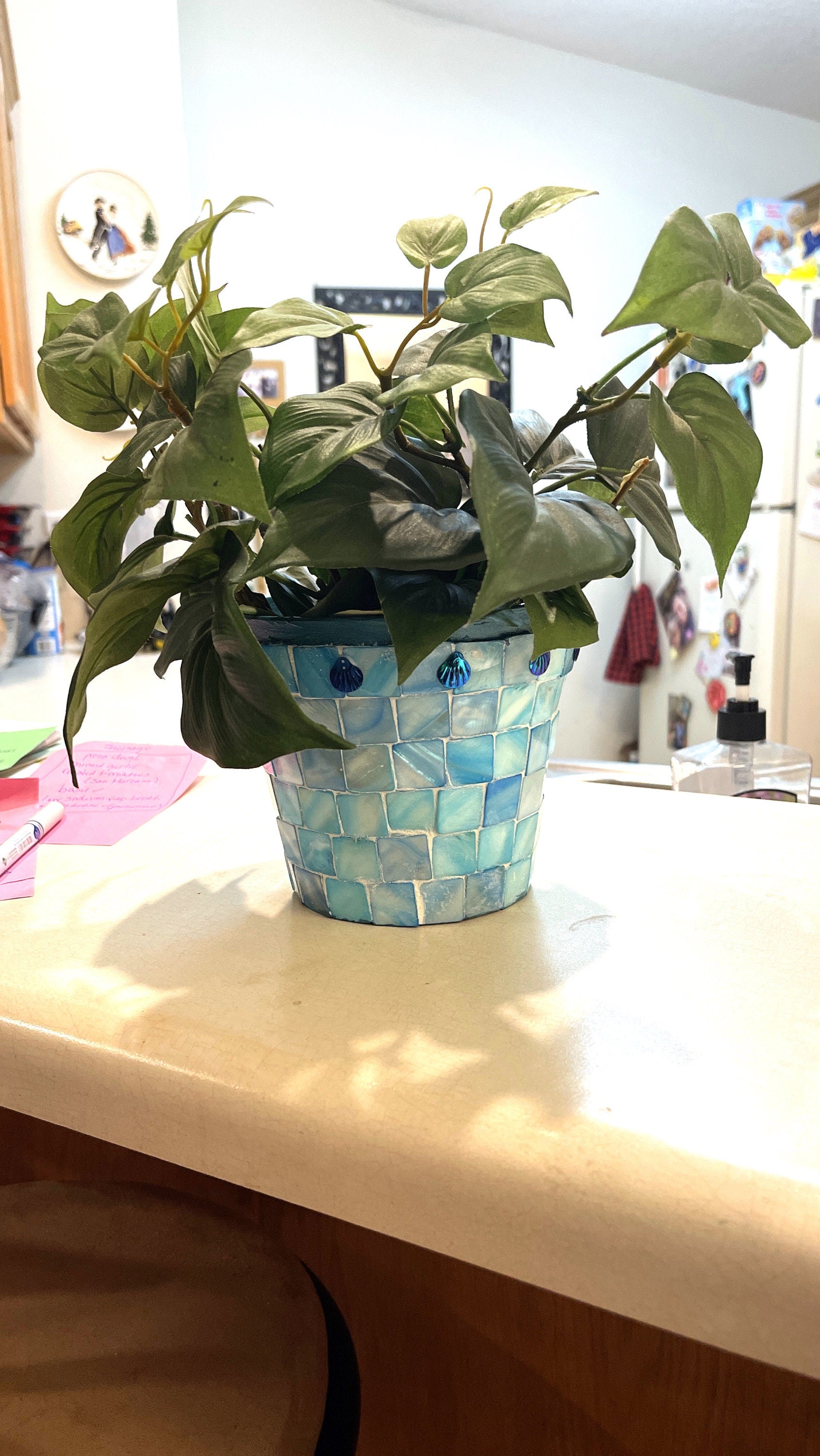 Artisan teal mosaic planter with mother of pearl accents, handcrafted by Miss Bette's Creations, featuring intricate mosaic details.