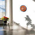 Mid-century modern mosaic decorative plate with colorful geometric patterns, displayed on a neutral background.