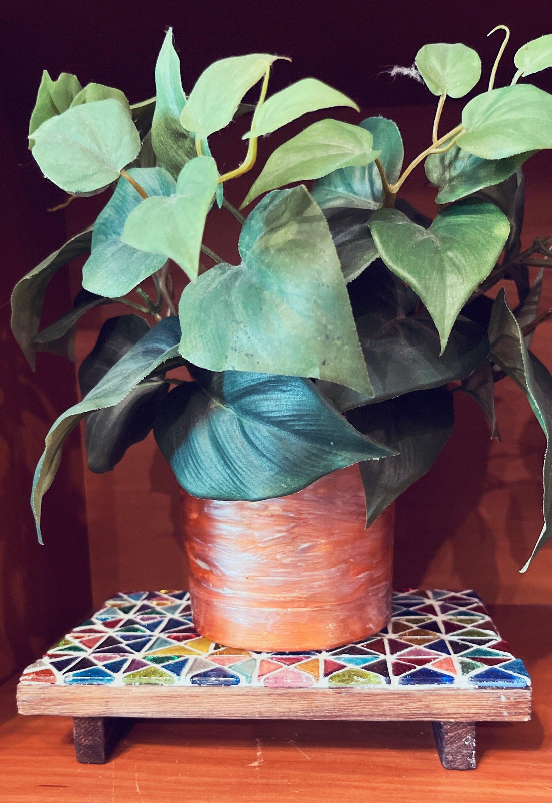 Handmade kaleidoscope mosaic decorative riser with colorful glass tiles, perfect for home decor or display.
