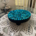 Artisanal turquoise cabochon mosaic plant stand by Miss Bette's Creations with colorful tiled design and sturdy base.