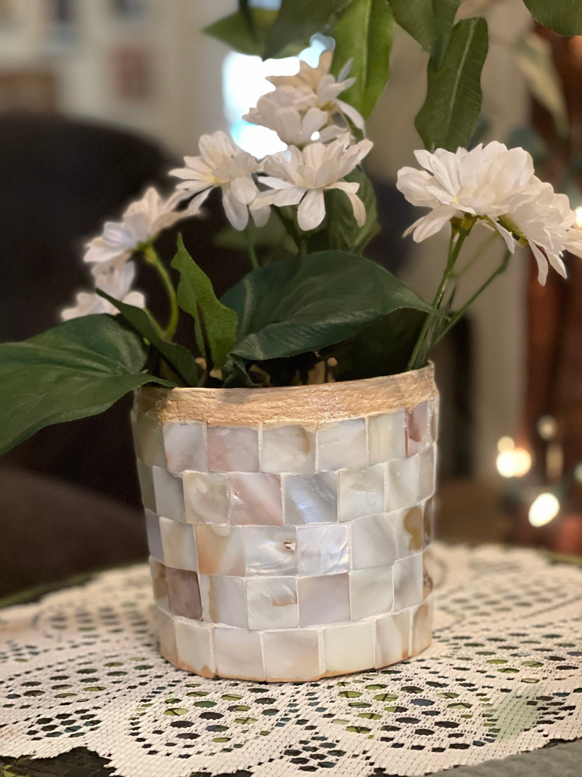 Handcrafted mother of pearl mosaic planter by Miss Bette's Creations, featuring intricate pearl inlay on a round ceramic base.