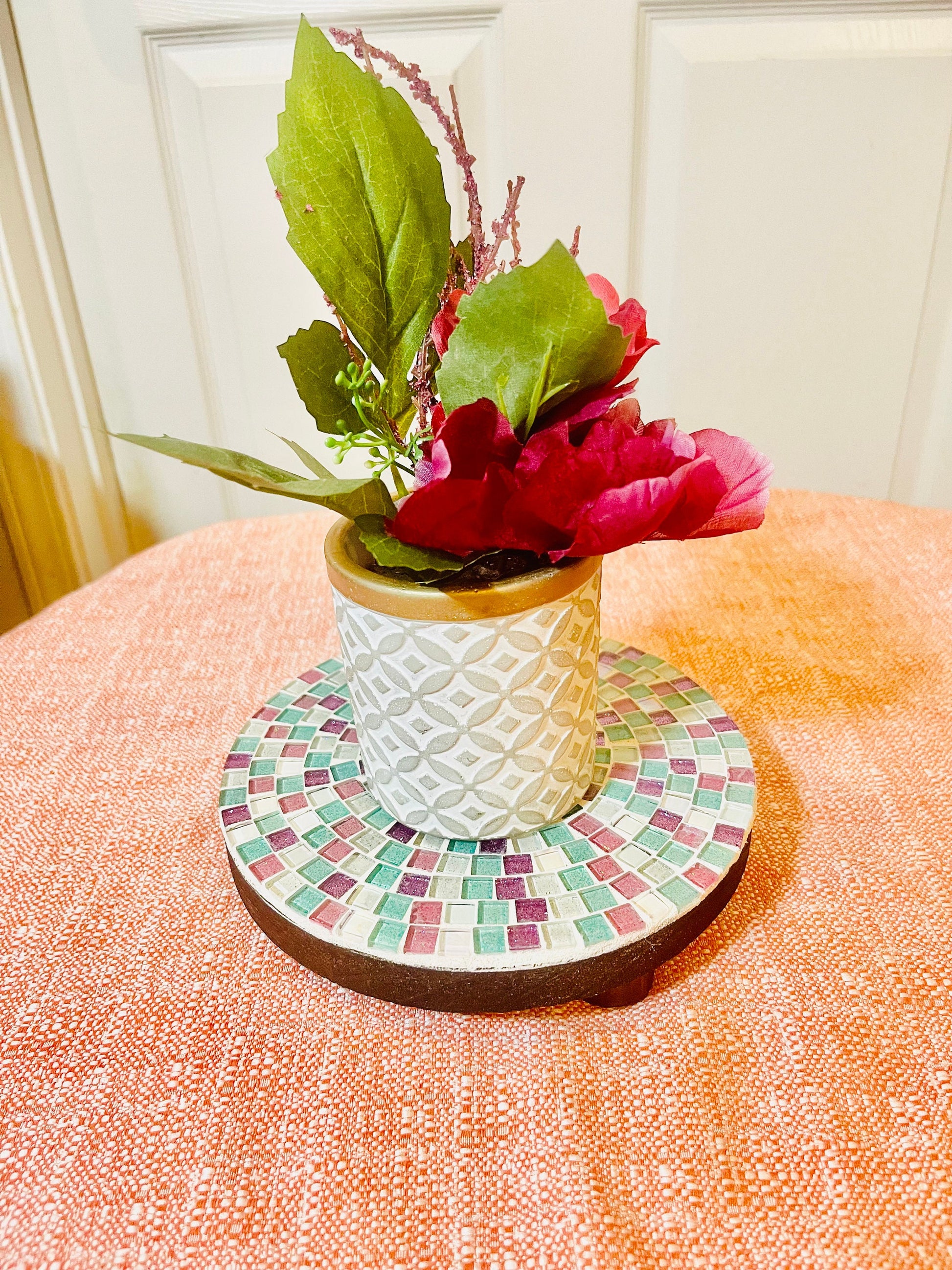 Handcrafted pink and green mosaic plant stand by Miss Bette's Creations, featuring vibrant geometric tile patterns.