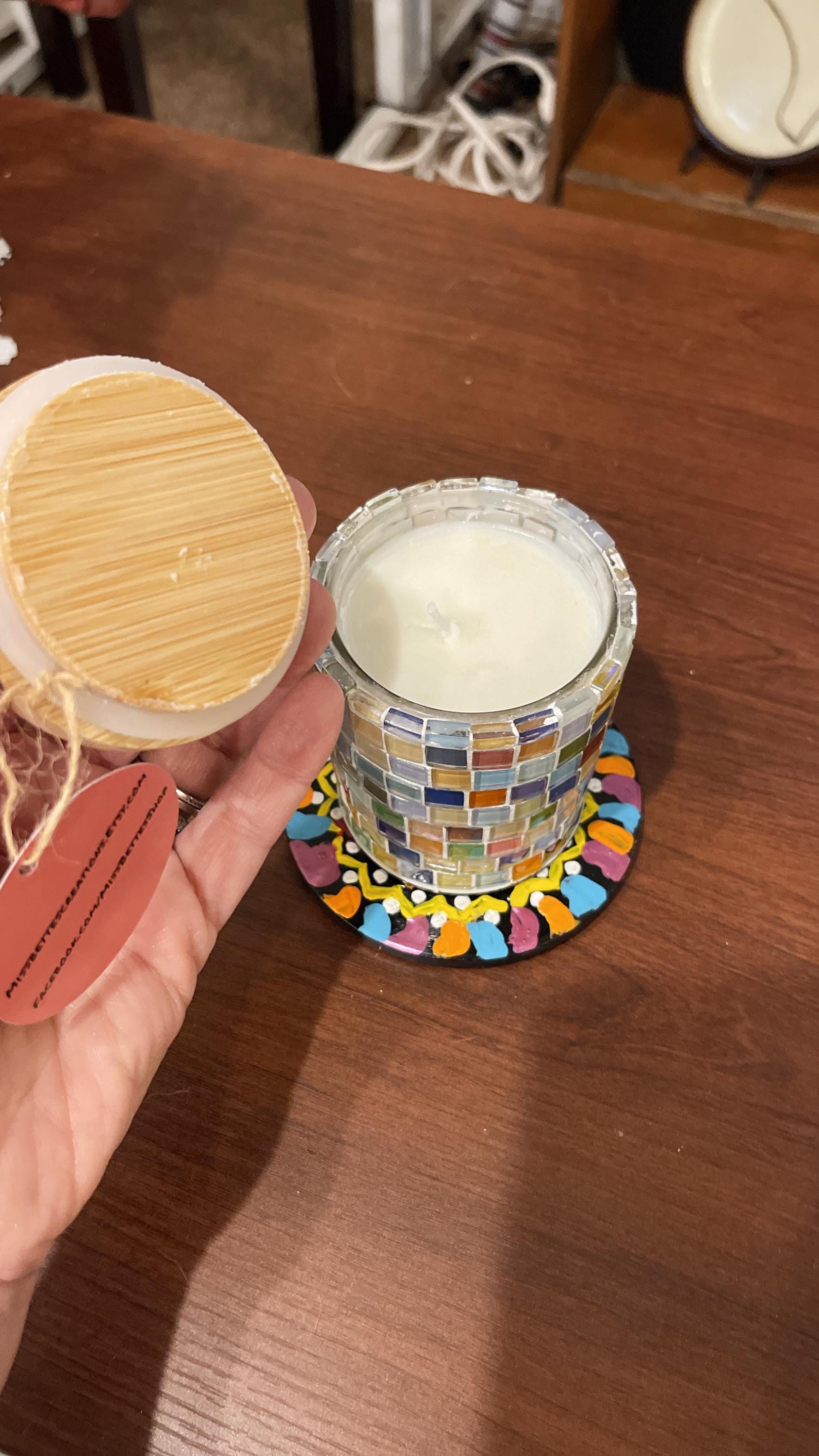 Handcrafted mosaic glass jar with bamboo lid, artisan home decor piece featuring colorful glass mosaic patterns.