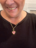 Gold sparkling rose-shaped heart locket with intricate design, perfect for sentimental jewelry.