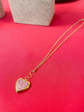 Gold sparkling rose-shaped heart locket with intricate detailing, perfect for jewelry lovers.