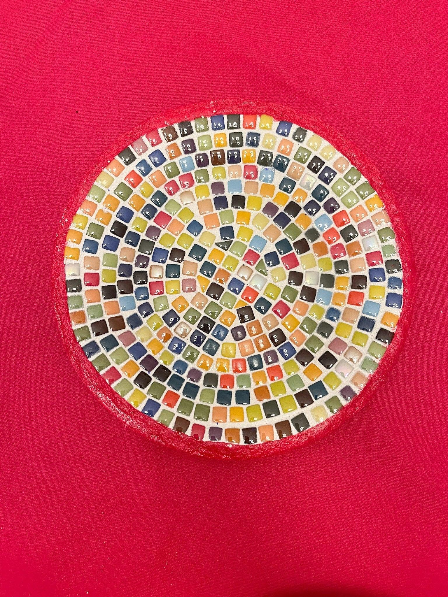 Vibrant handcrafted rainbow mosaic decorative plate with colorful glass pieces, showcasing intricate mosaic artwork.