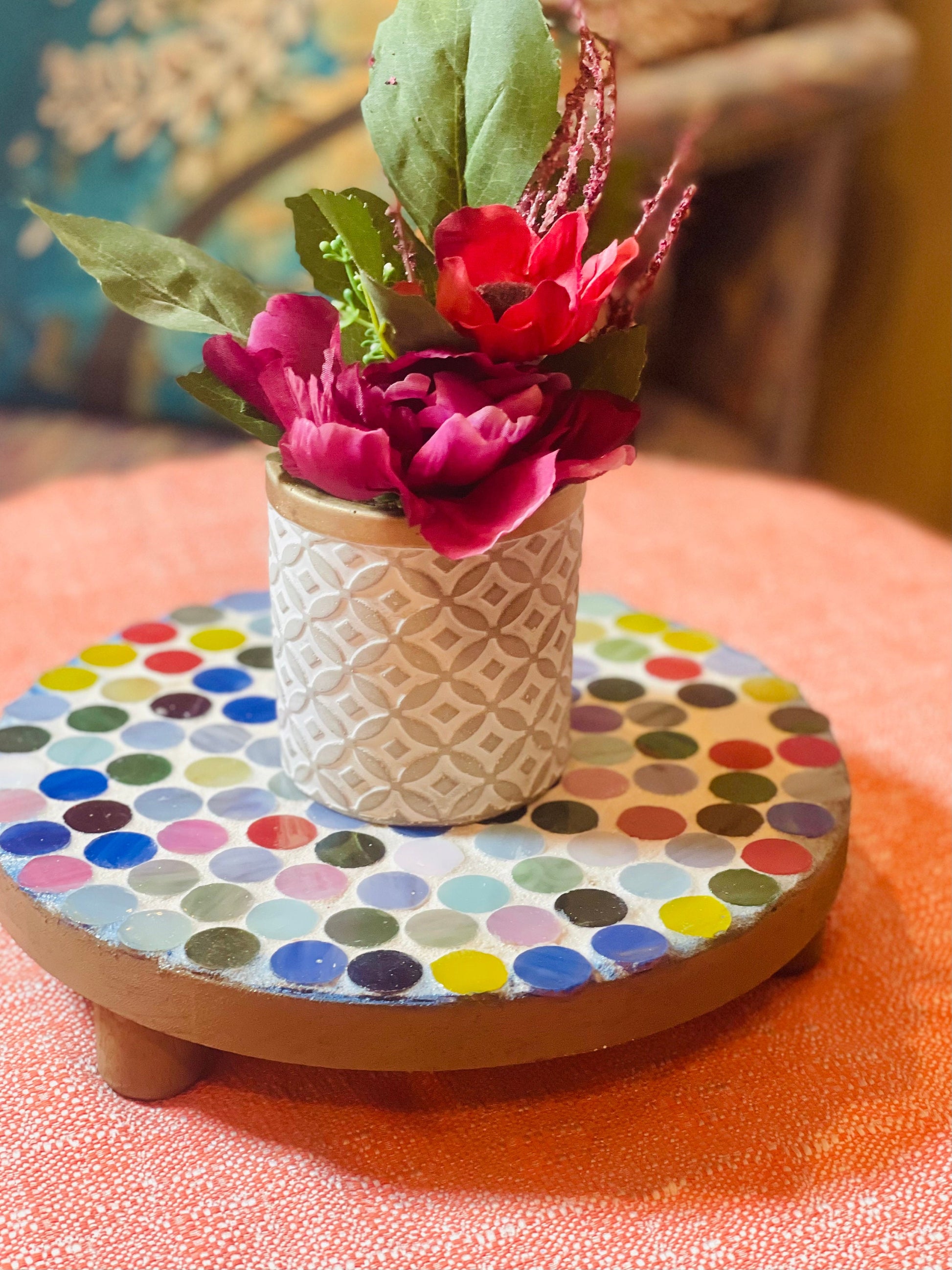 Colorful handcrafted polka dot rainbow mosaic plant stand by Miss Bette's Creations with a sturdy base and vibrant mosaic design