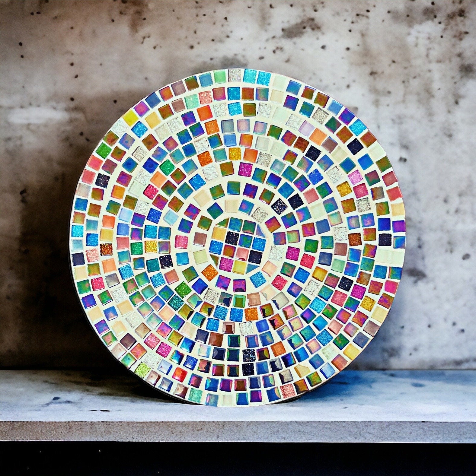 10-inch handcrafted rainbow mosaic plant stand by Miss Bette's Creations featuring colorful tiled design and sturdy metal legs.